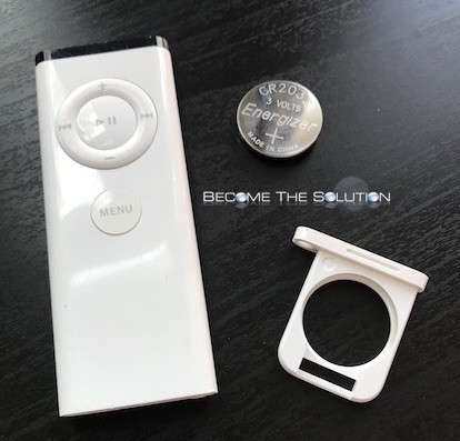 Apple white remote battery cover open